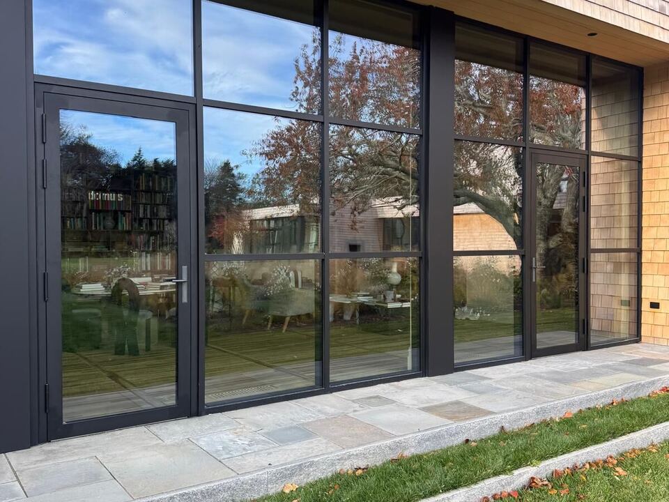 Black steel-look glass wall and entry door